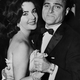 British-born US actress Elizabeth Taylor is pictured dancing with the film producer Mike Todd at a party in Greenwich, 09 december 1956. Mike Todd will become the next - and 3rd - husband of Liz Taylor in february 1957. (Photo credit should read -/AFP/Getty Images)
